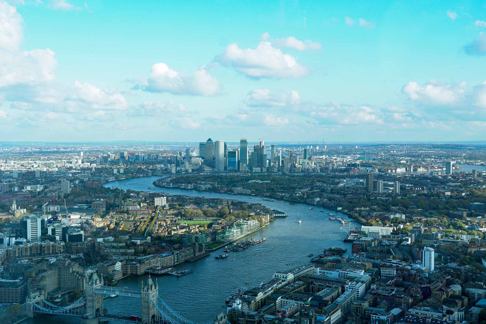 Aerial photo of the Thames in London, UK, facing East.